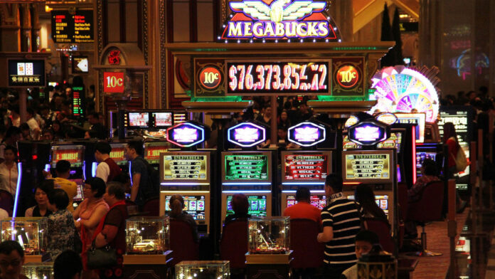 People playing slots in a casino