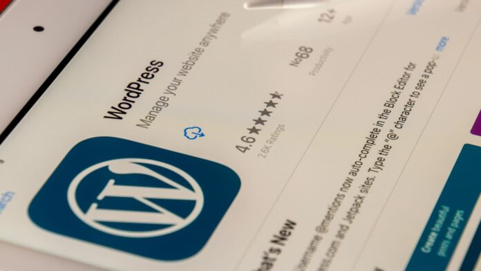 An iPad with WordPress admin screen visible